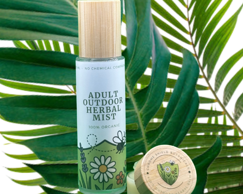 Bottle of 'Adult Outdoor Herbal Mist' with a wooden cap on green leaves